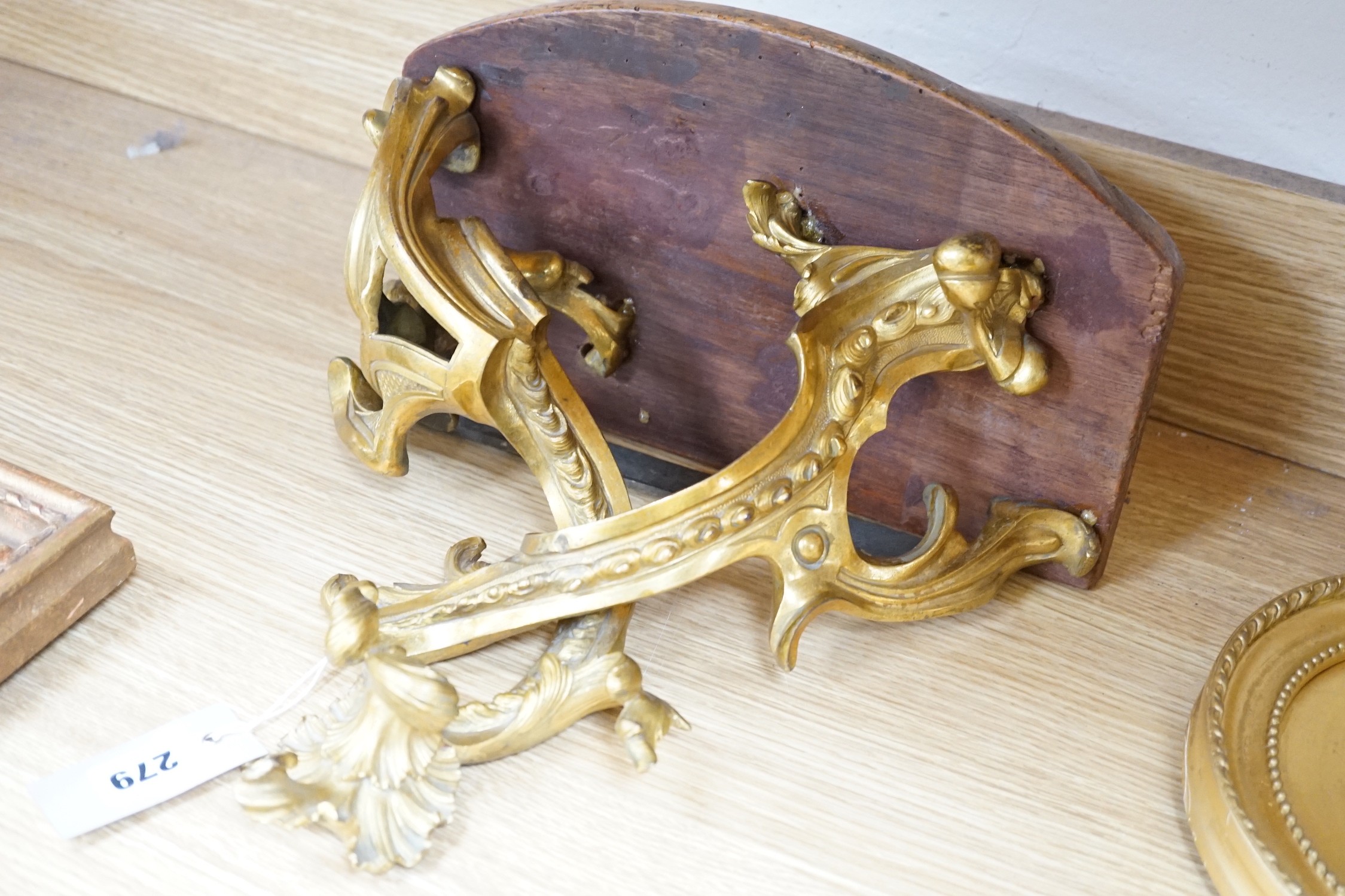 A French ormolu wall bracket, later mahogany top. 29x33cm